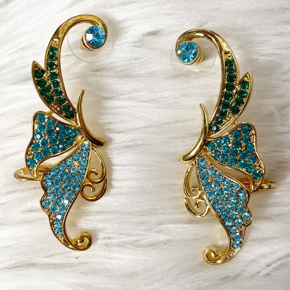 Gold butterfly wing earrings with blue and green stones